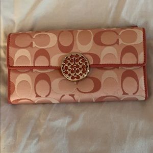 Large COACH pink trifold fabric wallet